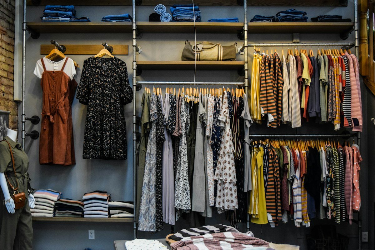 Inside a women's clothing showroom with colourful garments on display